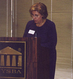 Lorraine Power Tharp, President of the New York State Bar Association, and forum moderator. 
